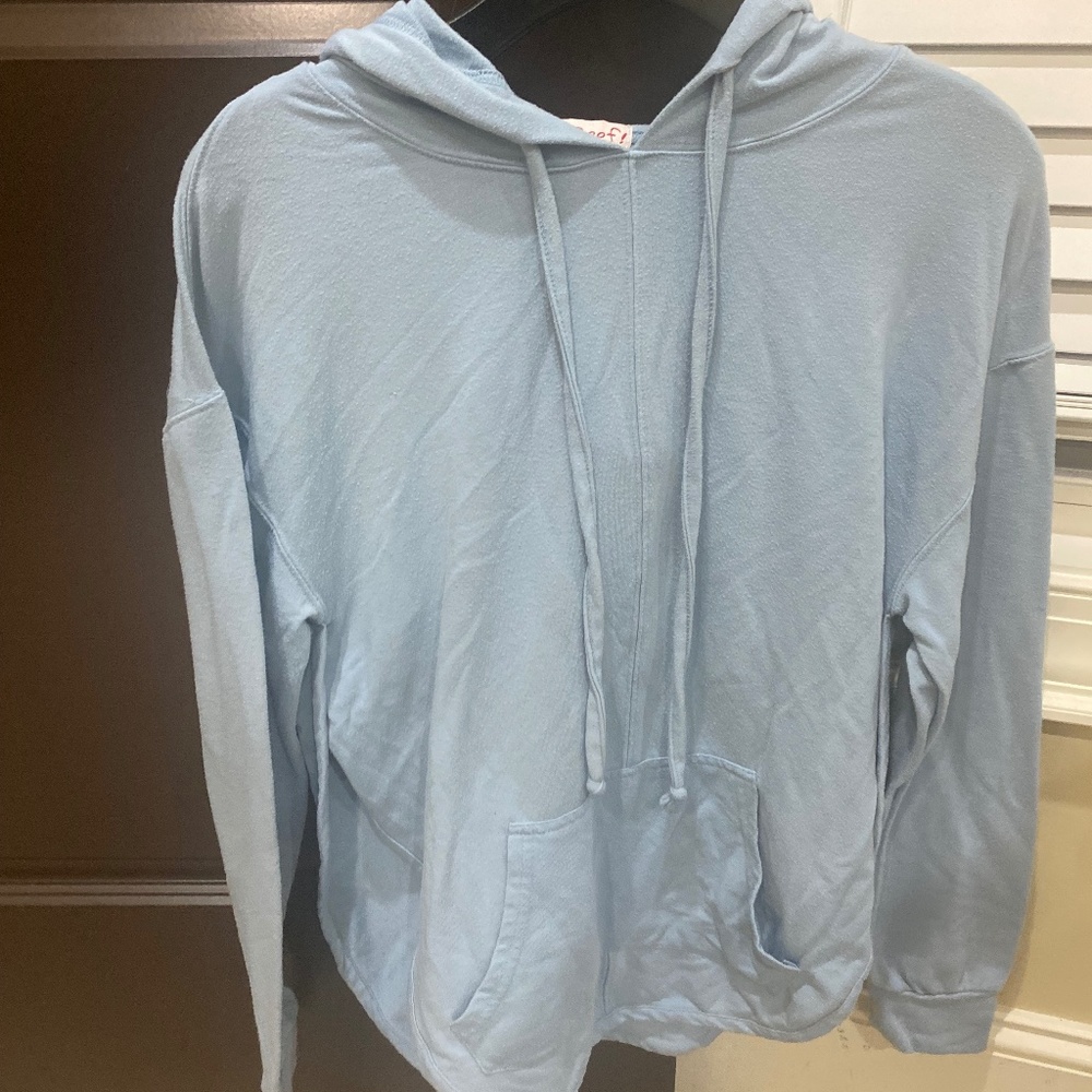 This is a Poof pullover shirt with and open back